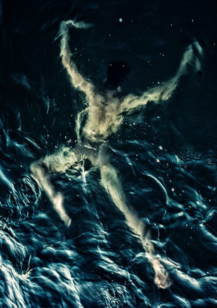 A male form swimming taken by the iconic photographer NANA SRT.